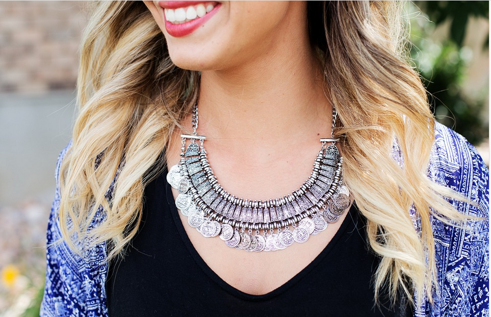 a woman wearing a necklace